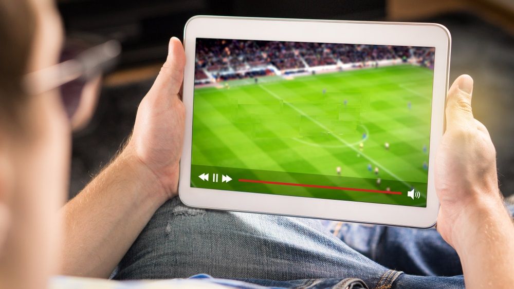 A person watching live stream on Tablet